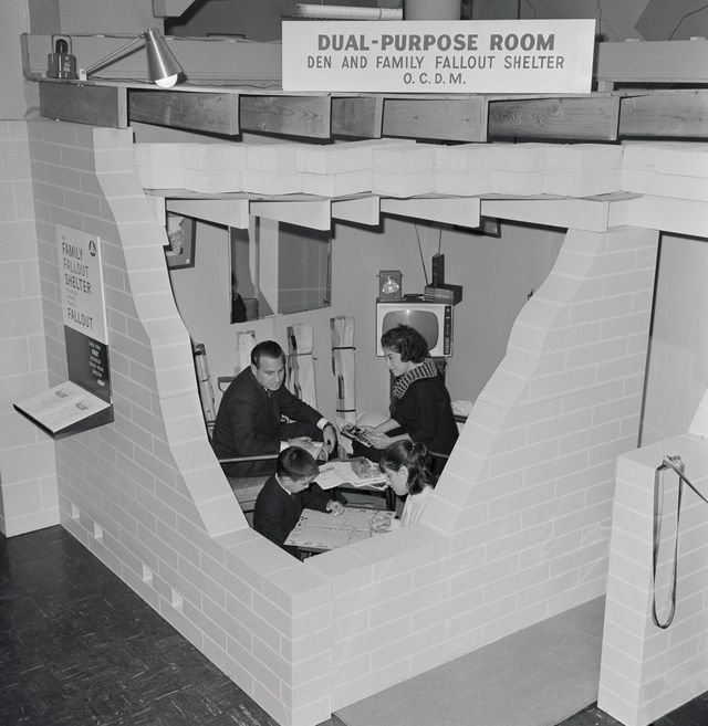 A family tries out a sample fallout shelter at Civil Defense headquarters in Manhattan, Nov. 2, 1960
